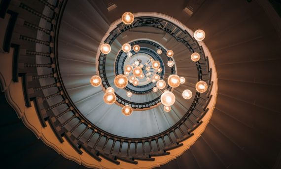 Photo vintage adjustable height globe pendant stairway light